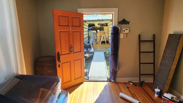 Protected doorway and ramp connecting the home to the moving truck